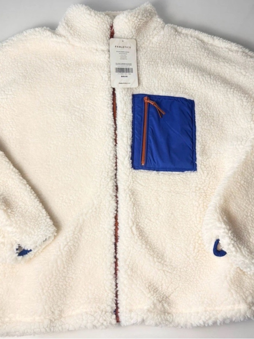 Fabletics Cream Teddy Jacket with Blue Chest Pocket